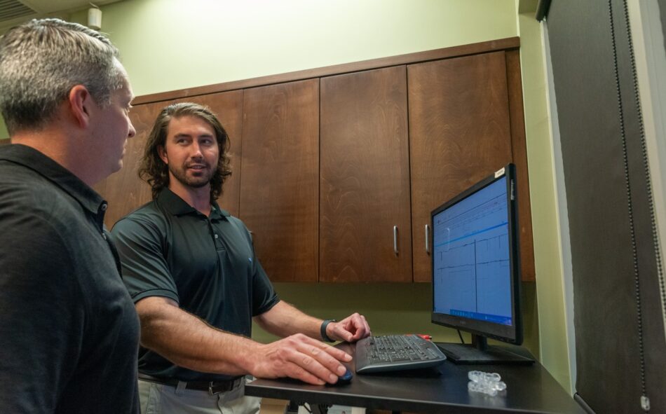 Dr. Cason checking patient scans at our Little Rock dental practice in Arkansas