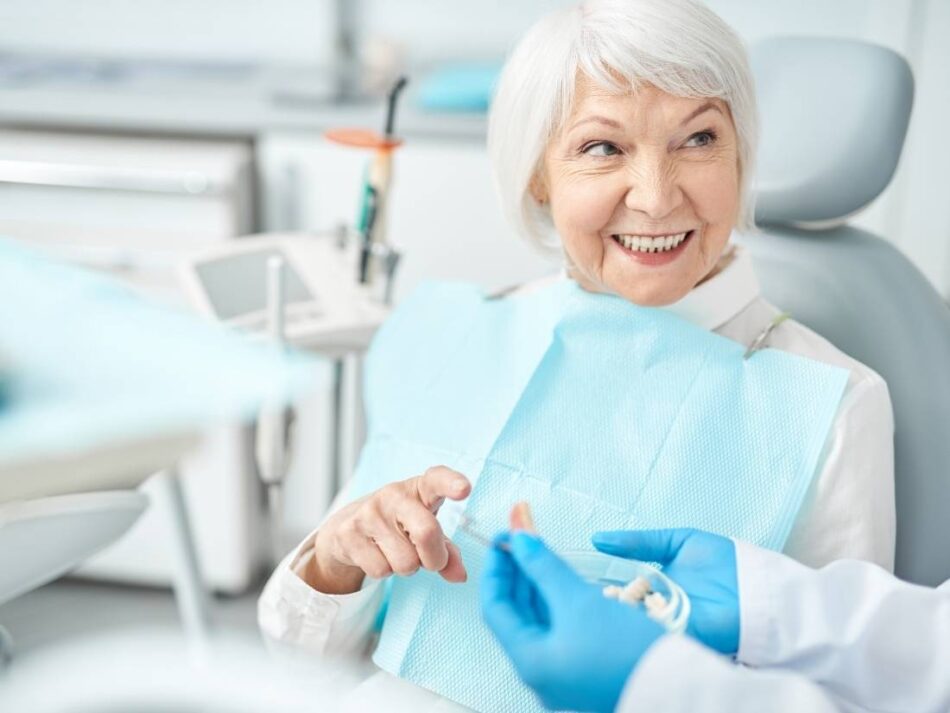 A smiling senior patient after getting dental implants with our Little Rock dentist